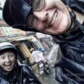 Evie and I on the back of our motorbikes enjoying the rainy experience!
