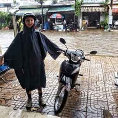 Evie ready to go out in the flooded streets with her poncho!